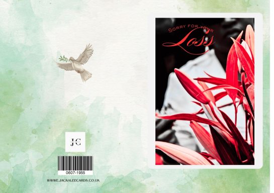 Red leaves in foreground with a small bird flying above on a soft green background.