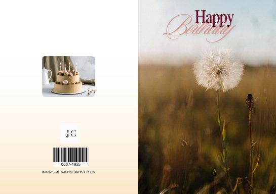 Dandelion and typewriter with "Happy Birthday" text on a soft background.