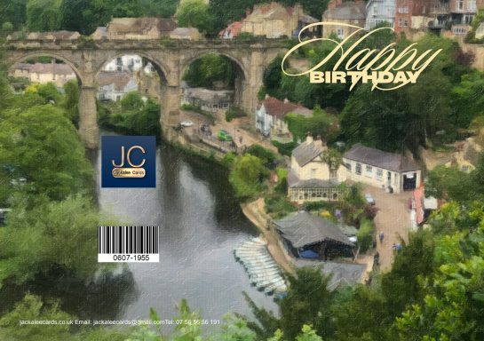 A scenic view of a river, buildings, and greenery with a birthday greeting.