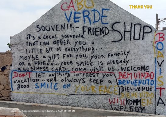Colourful wall mural with text advertising a souvenir shop in Cabo Verde.