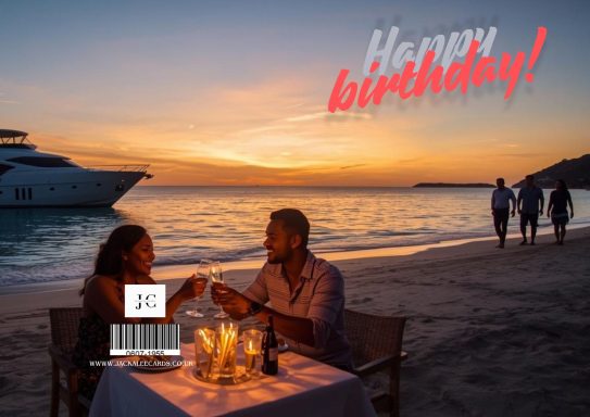 JC 0023 Couple celebrating a birthday at sunset on a beach, with a boat in the background.