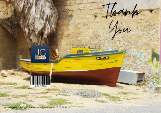 Yellow fishing boat next to a wall, with "Thank You" text above it.