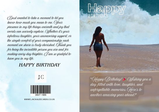 A woman walking along a beach with waves crashing in the background.