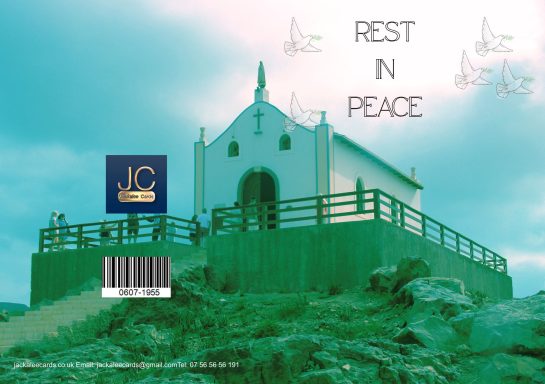 A white chapel on a rocky hill with "Rest in Peace" inscribed above.