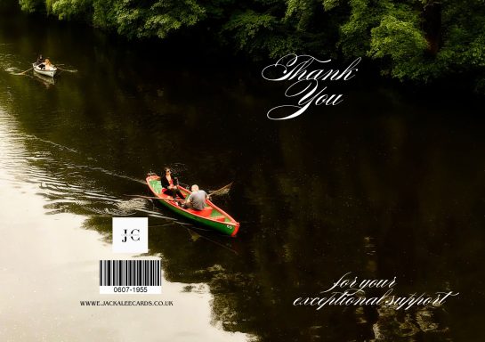 A couple kayaking on a calm river surrounded by lush greenery.