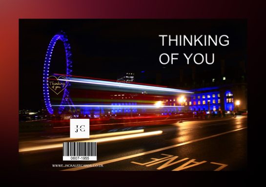 Night scene featuring a brightly lit Ferris wheel with the text "THINKING OF YOU."