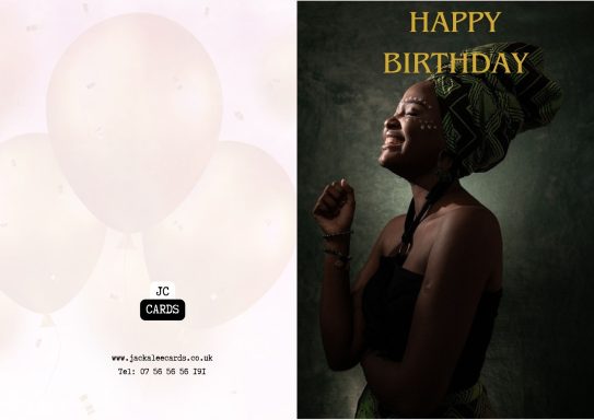 JC 0025 A woman in a traditional headwrap smiles, with "Happy Birthday" text above her.