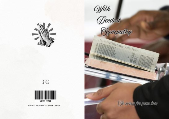 A person holding a book with a barcode on the cover, featuring decorative elements.