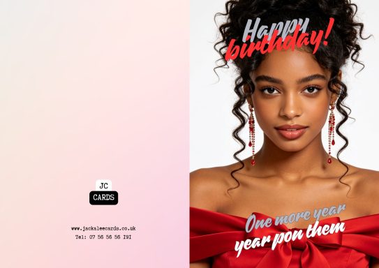JC 0029 A young woman with curly hair wearing a red off-shoulder top, celebrating a birthday.