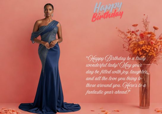 A woman in a blue gown stands against a pink background with birthday decorations and flowers.